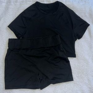 Top and shorts in black colour, Size S .